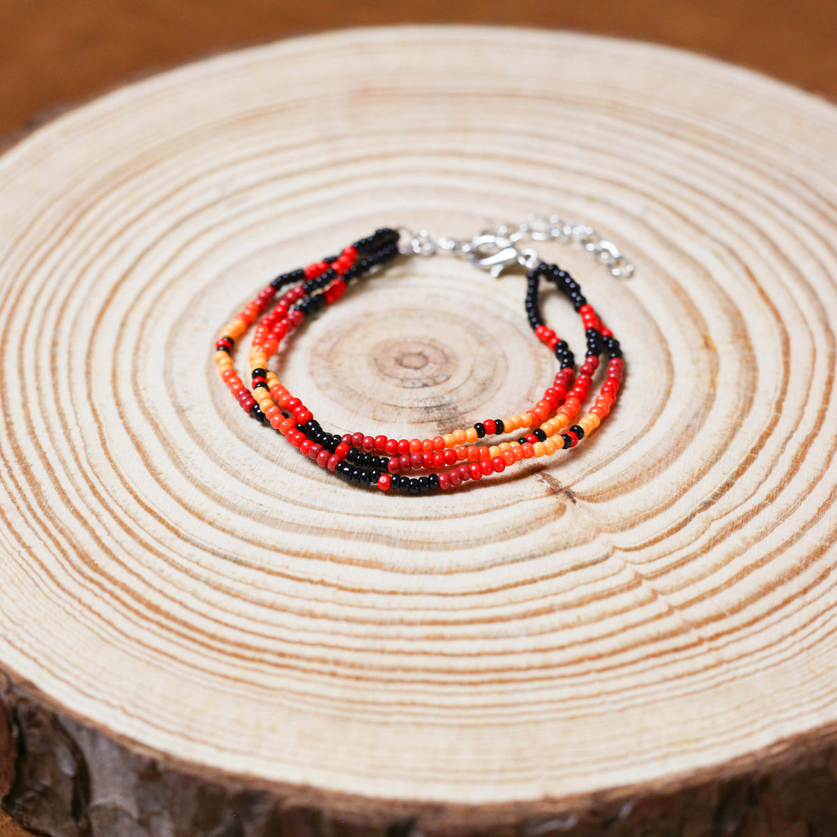 Sunset Harmony Beaded Bracelet – Bold Red, Orange, Yellow, and Black Strands